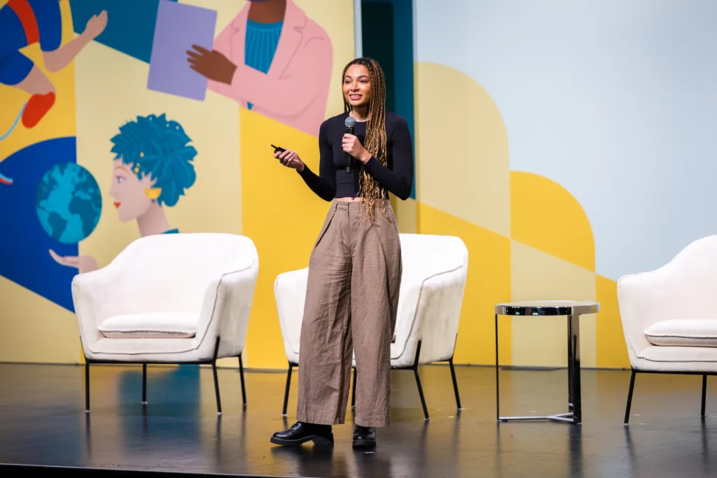 social entrepreneur pitches on stage at SOCAP23